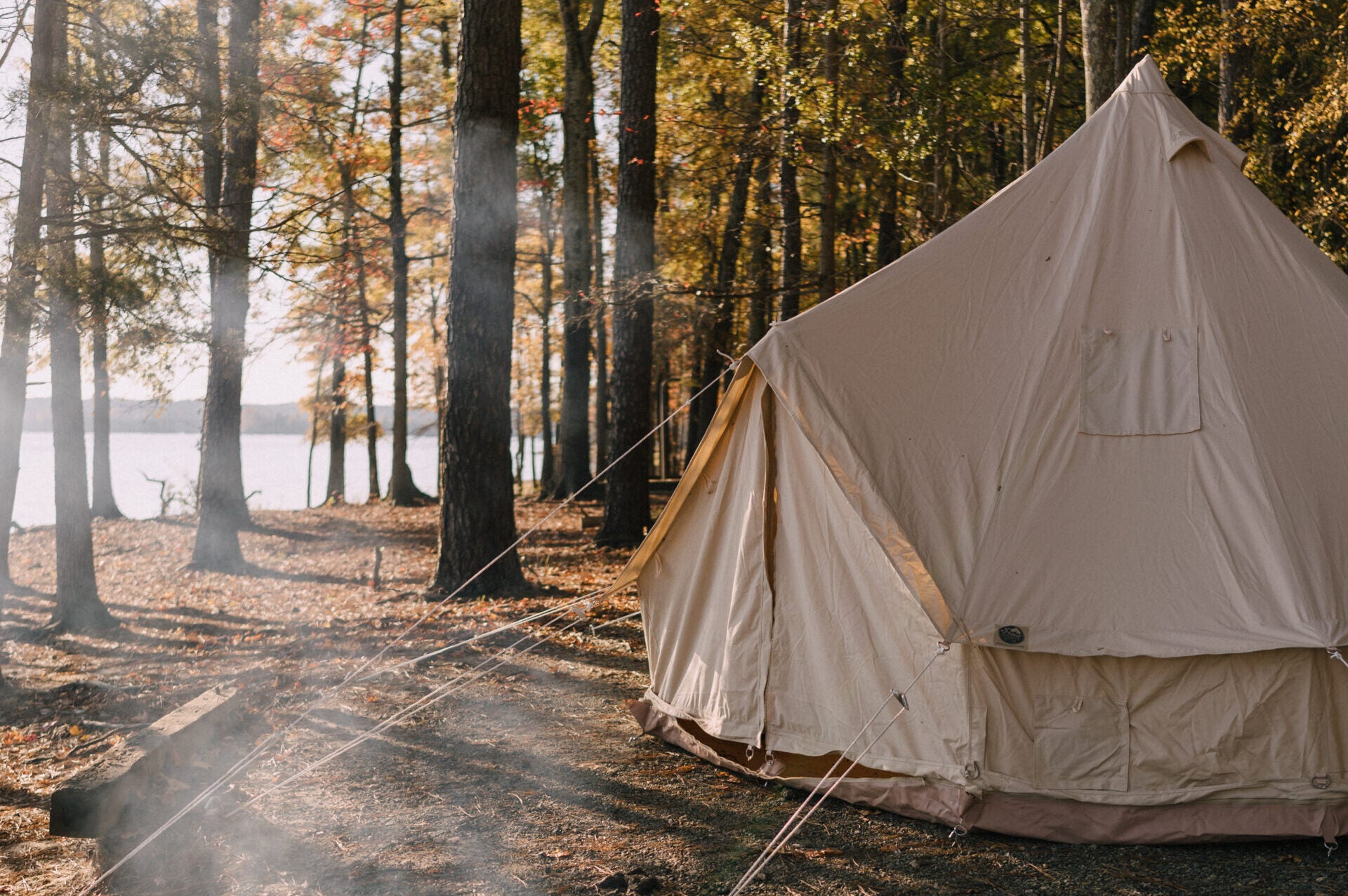 Stout Sunforger bell tent with wood stove jack at a snowy hunting base camp