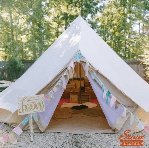 Luxury bell tent on a lawn serving as a permit-free guest house alternative