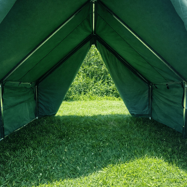 Green tent entrance with grass and trees in the background