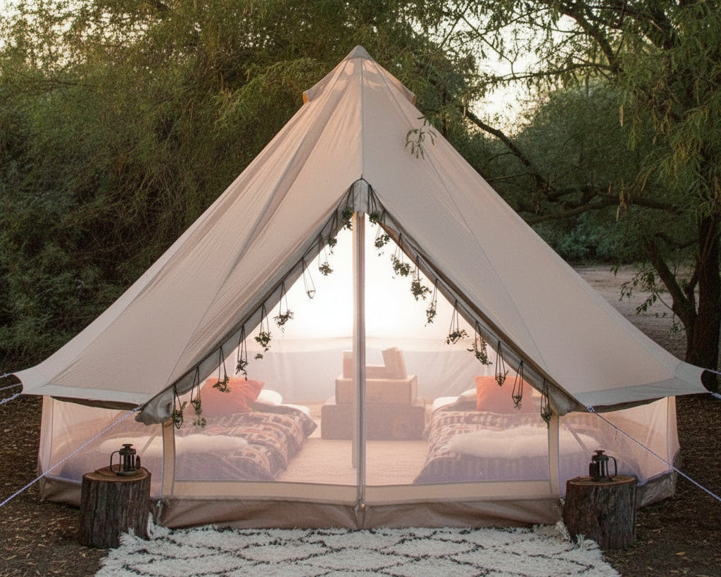 Camping tent with outdoor furniture and decor in a natural setting