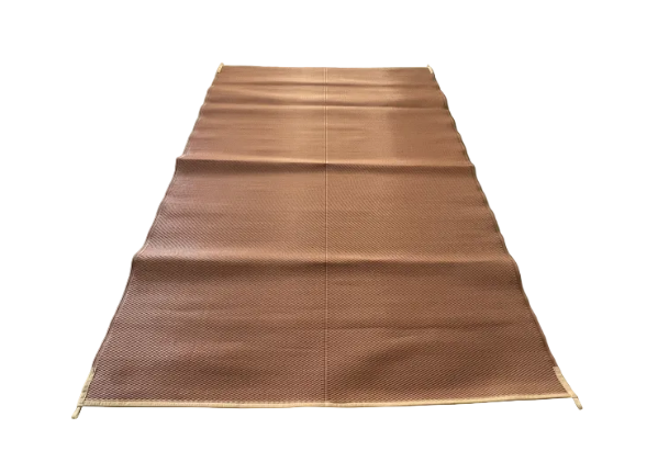 Brown woven mat on a concrete floor