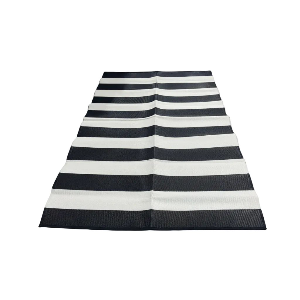 Black and white striped rug on a white background