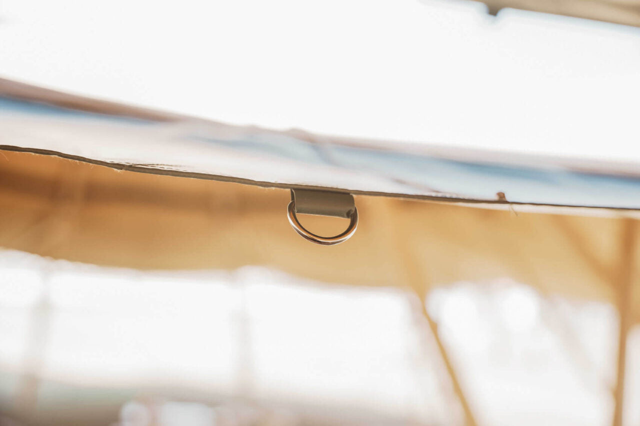 Close-up of a d-ring on a beige tent