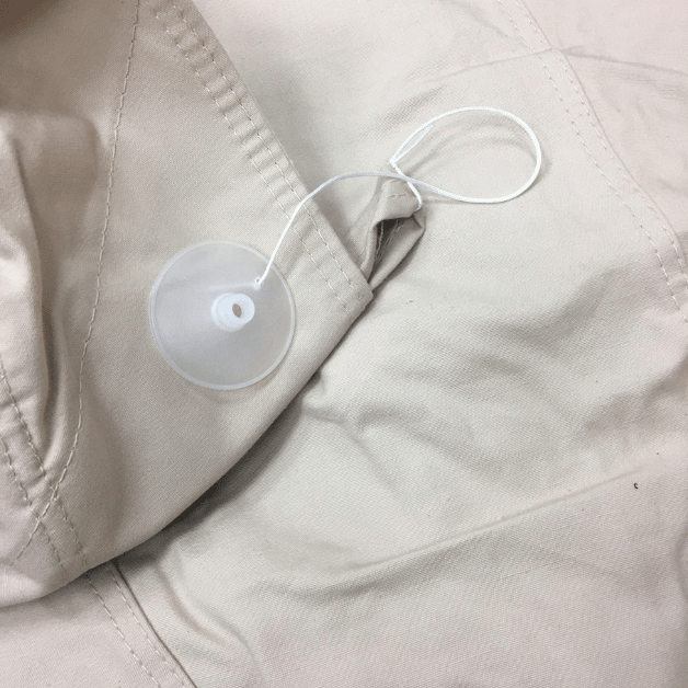 Close-up of a a tent top cap on beige fabric