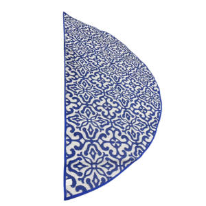 Blue and white patterned half-circle rug on a white background
