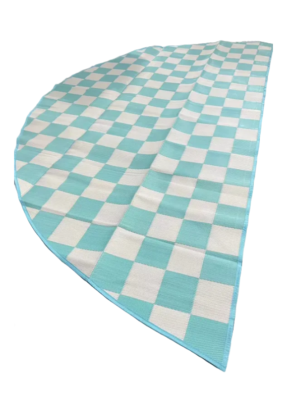 Checkered blue and white rug on a patterned floor