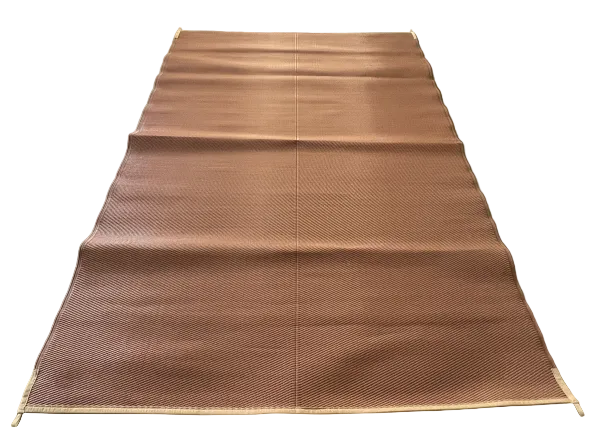 Brown woven mat on a concrete floor