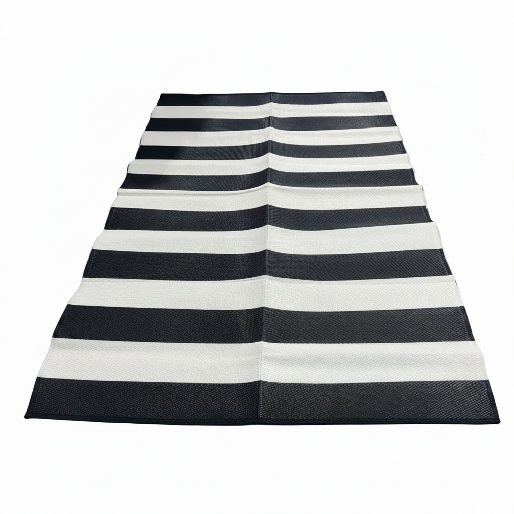 Black and white striped rug on a white background