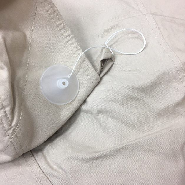 Close-up of a a tent top cap on beige fabric