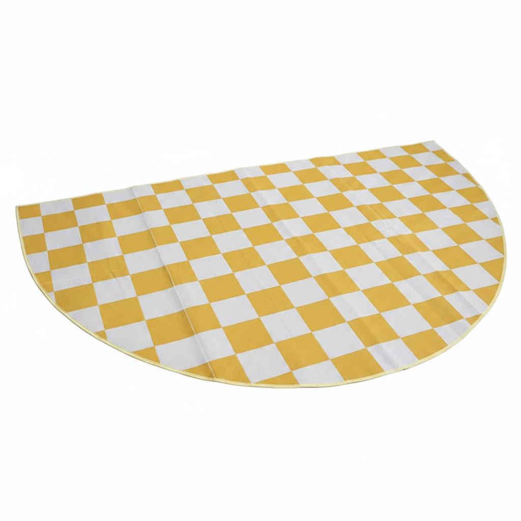 Yellow and white checkered mat on a green floor