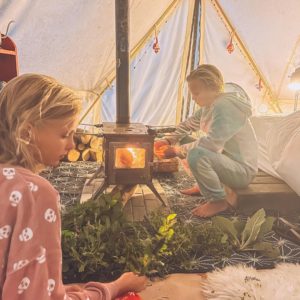 Twin girls enjoy time in their Stout bell tent