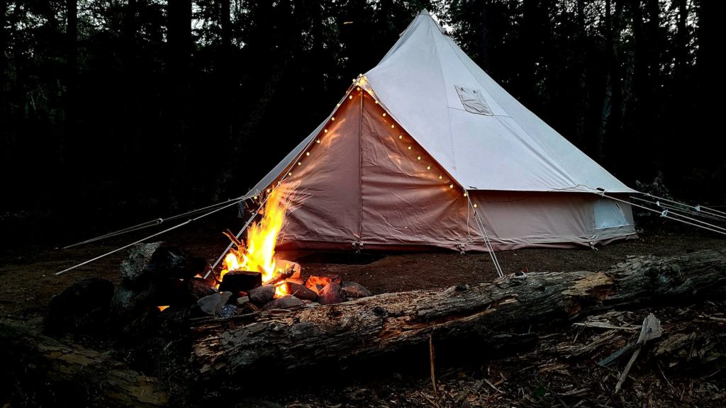 Stout bell tent glamping at night in Maine