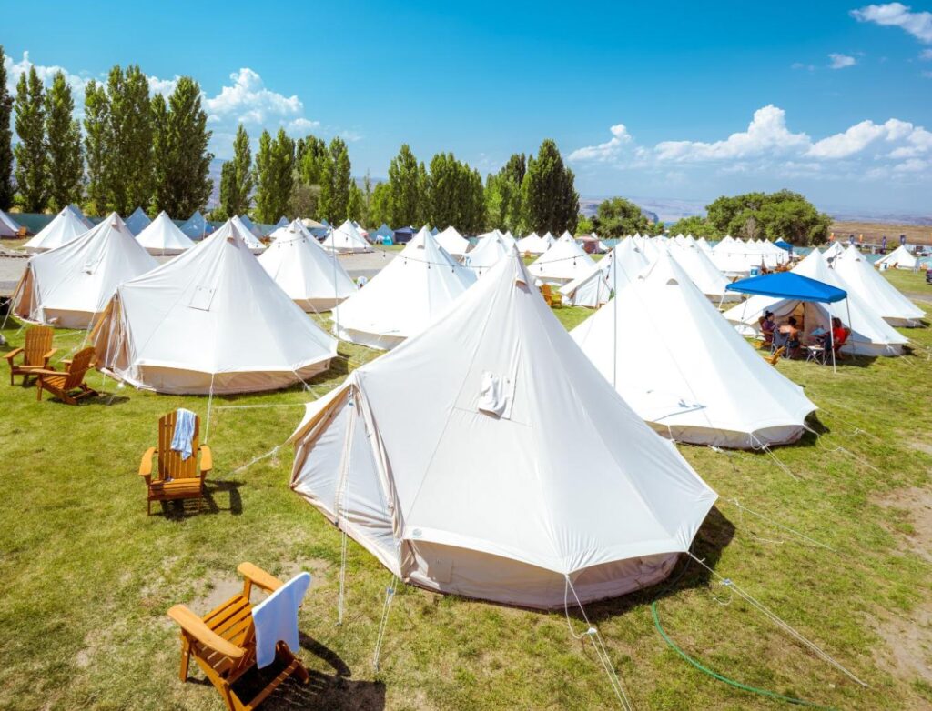 Stout Bell Tent vs White Duck comparison: Professional glamping setup at The Oasis, Gorge Amphitheatre.