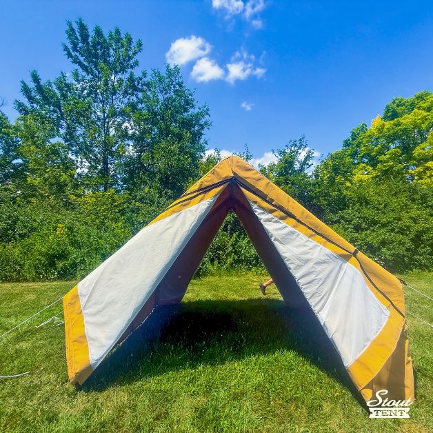 Tan canvas wall tent with both doors open, showing a bright and spacious interior.