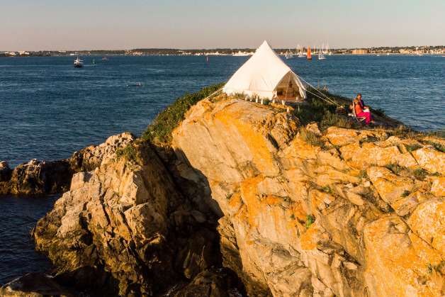 Luxury 5M Pro Double-door Stout Bell Tent pitched on a coastal wood platform with professional rigging.