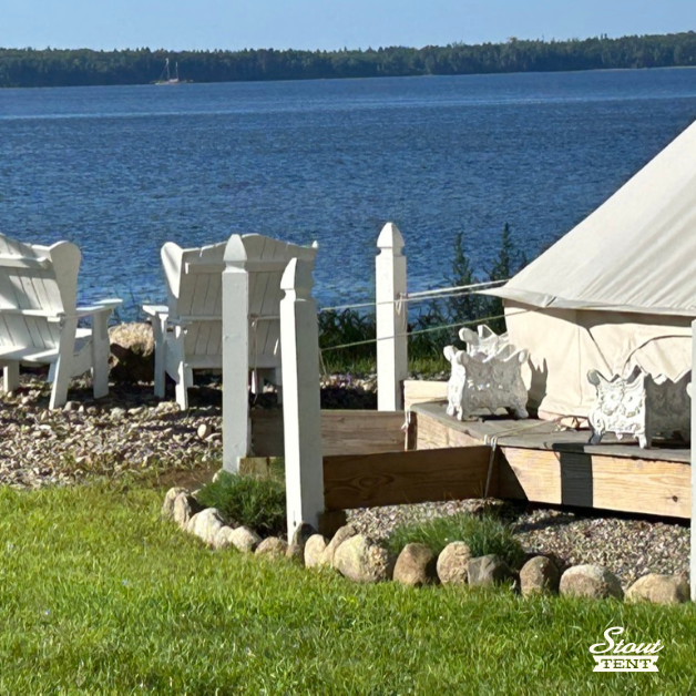 Luxury 5M Pro Double-door Stout Bell Tent pitched on a coastal wood platform with professional rigging.