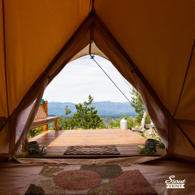 View from inside a luxury Stout Bell Tent overlooking the Blue Ridge Mountains with a professional wood platform.